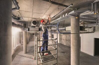 Site worker working on fischer installation systems